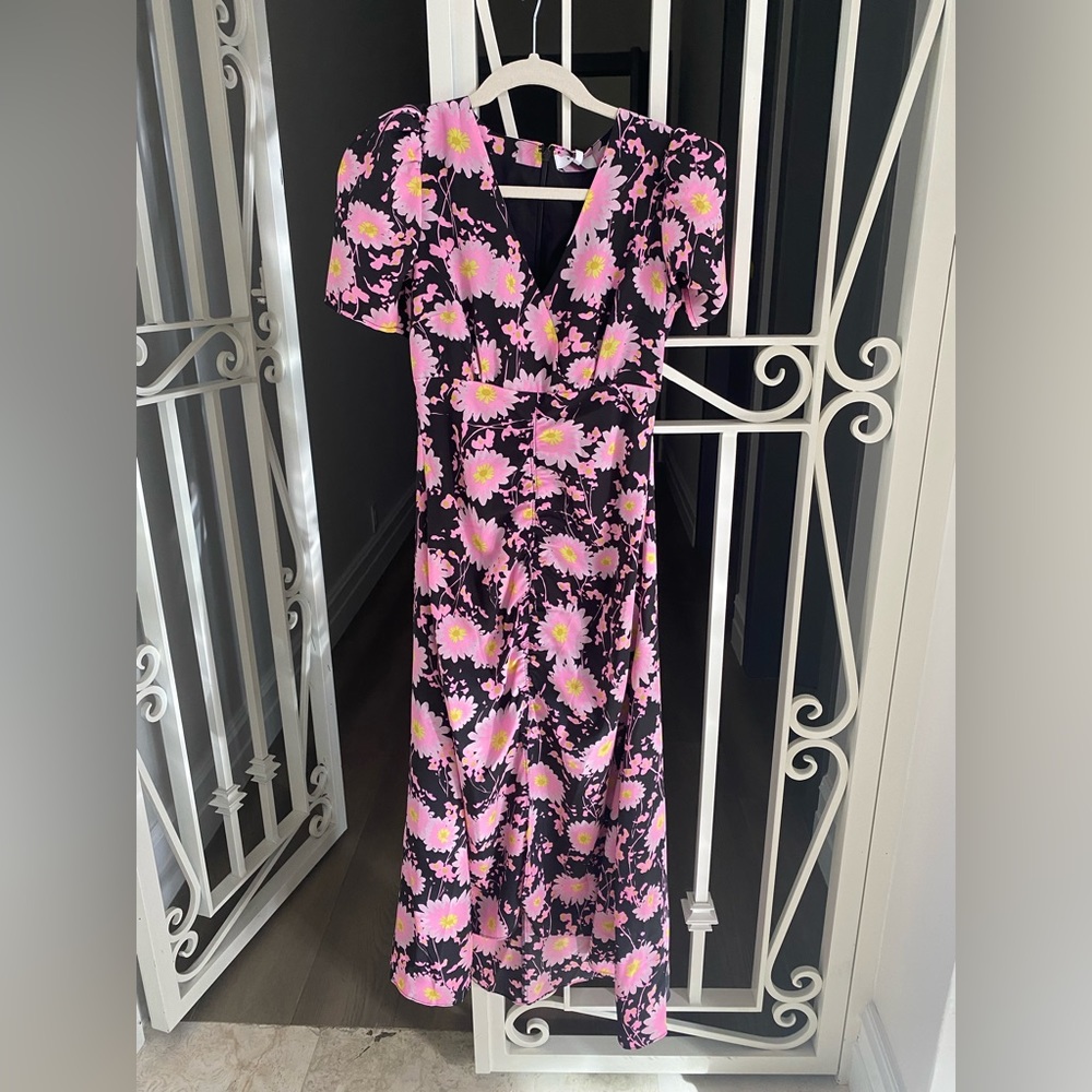 Likely dress size 0 black and floral dress new with tags never worn